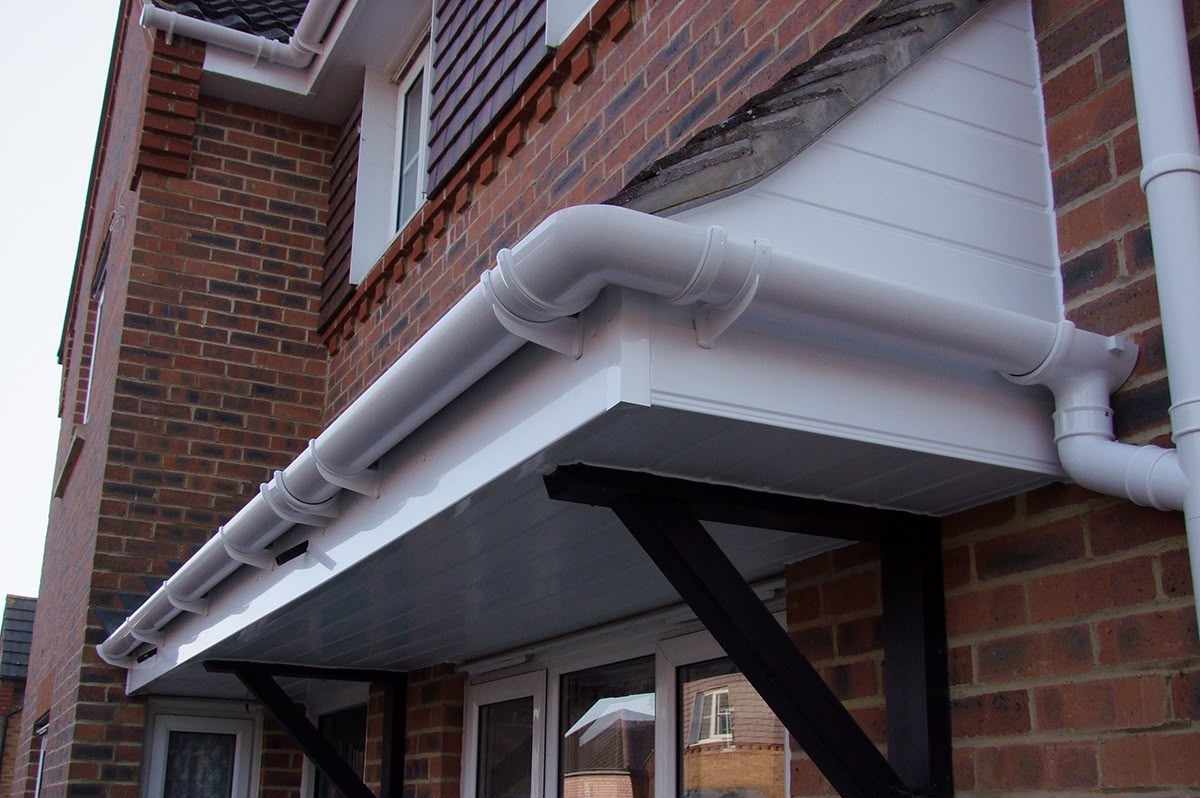 White fascia soffit and guttering around a porch roof